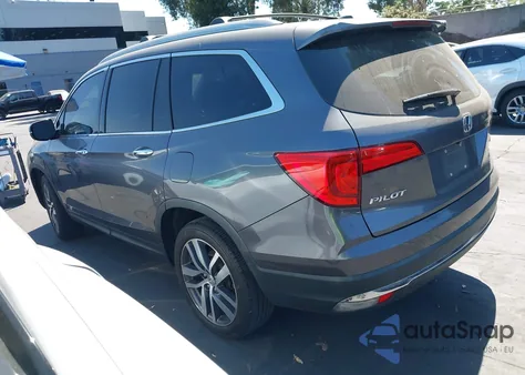 2018 Honda Pilot Touring z USA, uszkodzony, nr VIN 5FNYF5H98JB027001